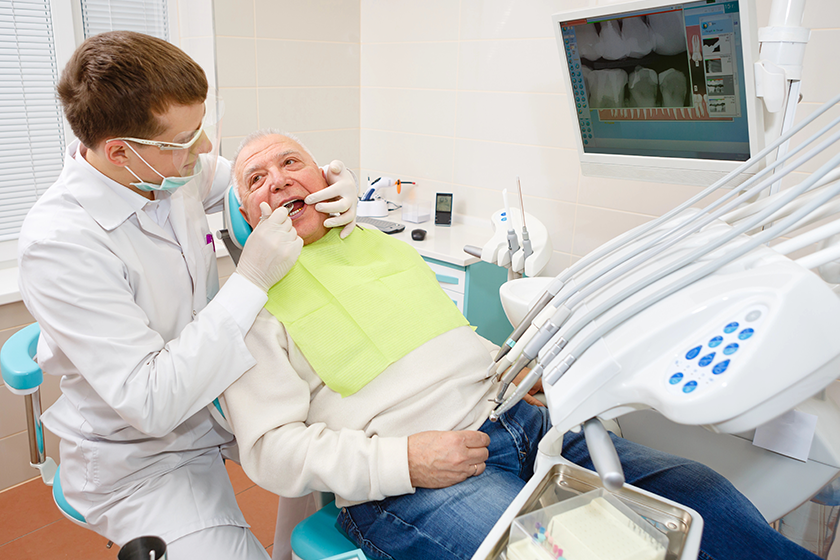 senior man dentist surgery having teeth check