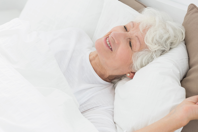 smiling old woman sleeping