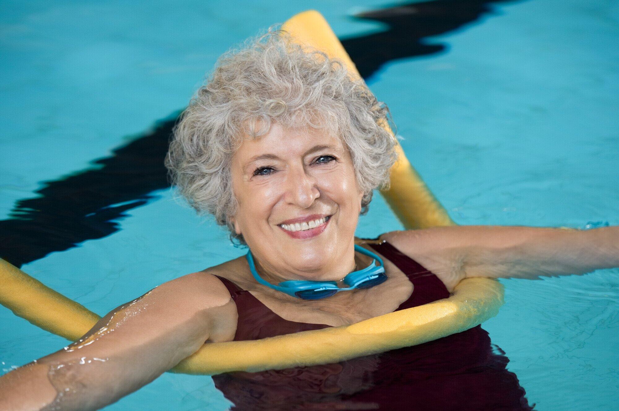 Senior woman doing aqua fitnes