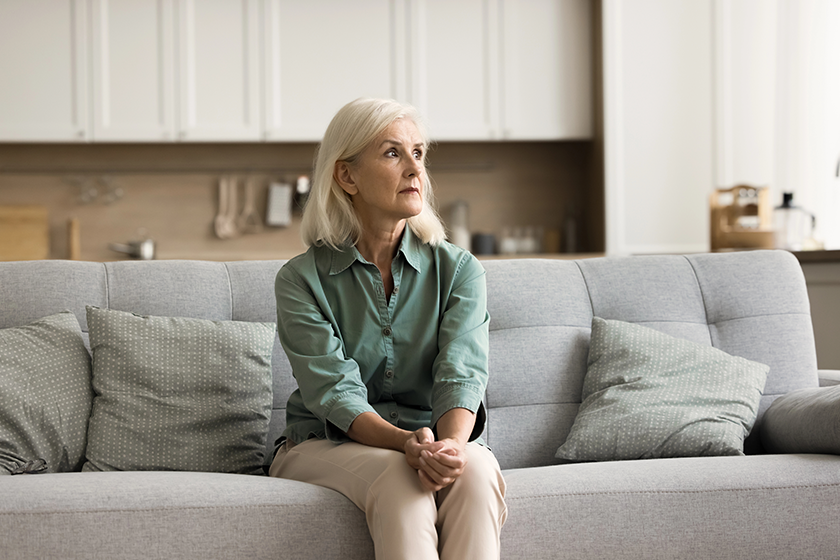concerned blonde senior woman sitting concerned blonde senior woman sitting