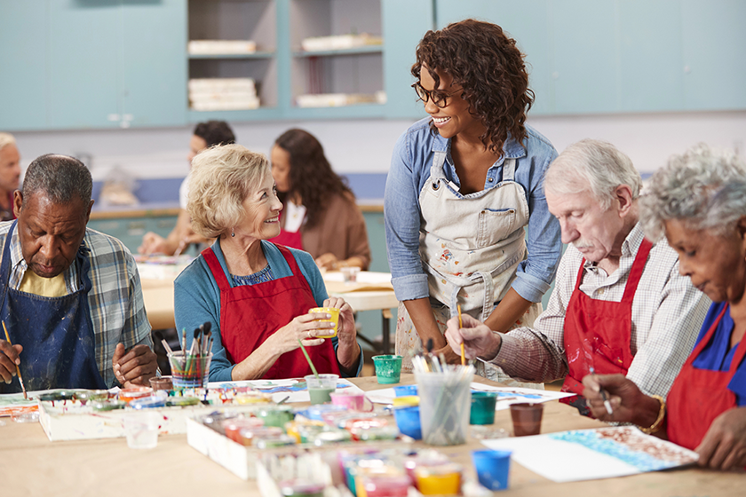 group retired seniors attending art class