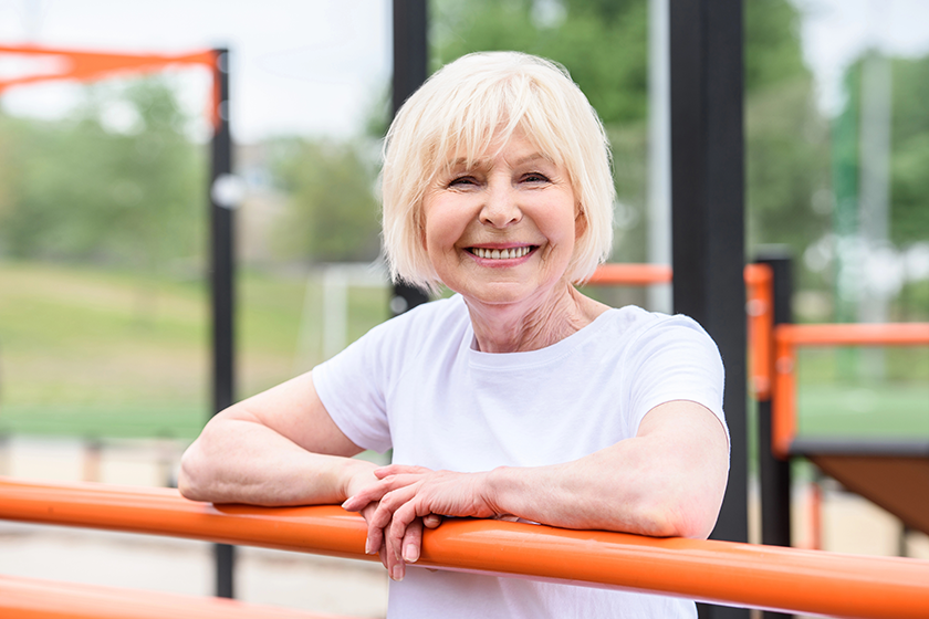 smiling senior woman standing smiling senior woman standing