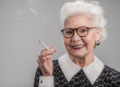 emotional senior lady smoking