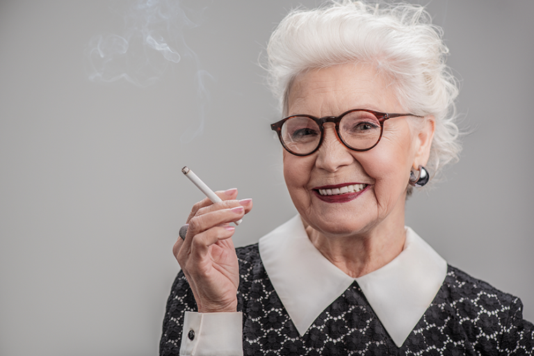emotional senior lady smoking