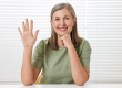 happy woman waving hello