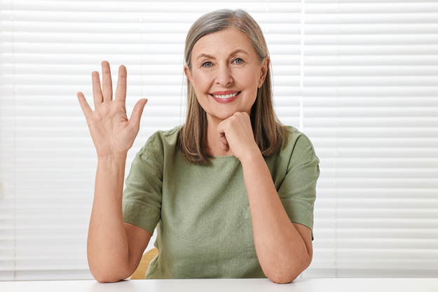 happy woman waving hello