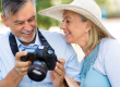 mature couple with digital camera