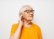 Photo of retired old lady vision problems with glasses close up