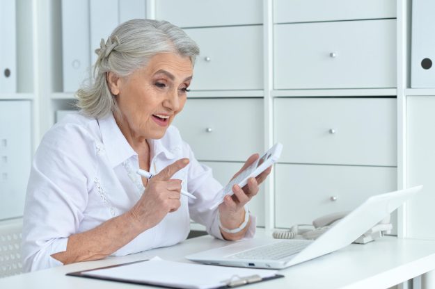 Portrait of senior business woman working in office
