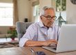 Senior,Man,Working,With,Laptop,At,Home.,Old,Man,Using