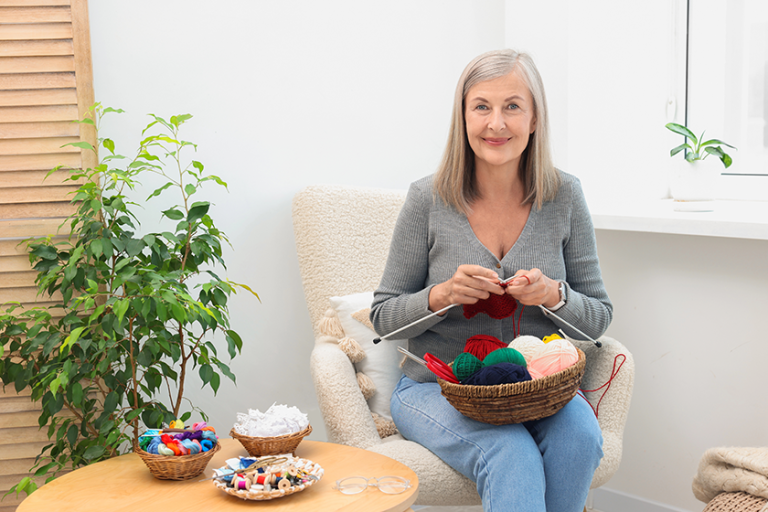 beautiful senior woman knitting