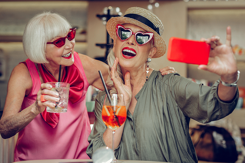 delighted positive woman taking a selfie