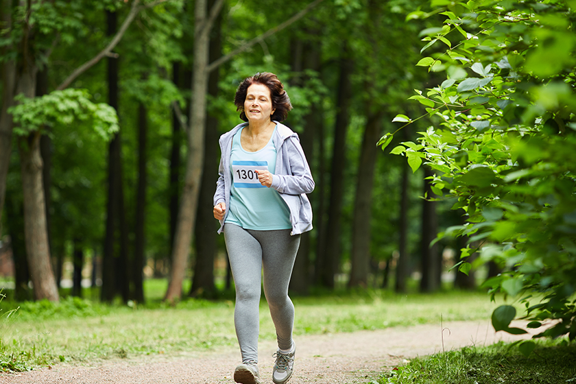 full body shot modern mature woman brown hair running