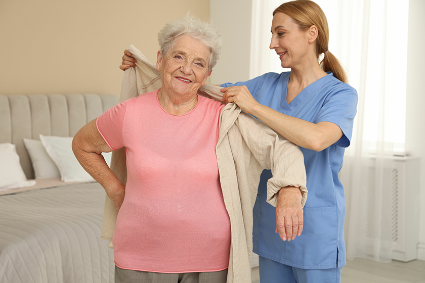 healthcare worker helping senior woman healthcare worker helping senior woman