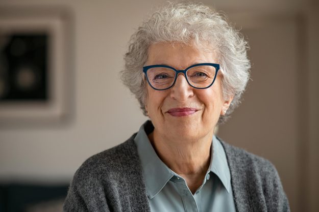Portrait,Of,Happy,Retired,Senior,Woman,Looking,At,Camera,While Portrait,Of,Happy,Retired,Senior,Woman,Looking,At,Camera,While
