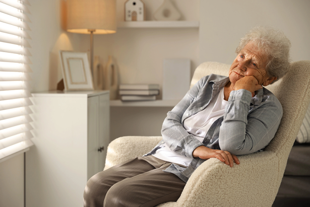 loneliness concept sad senior woman sitting