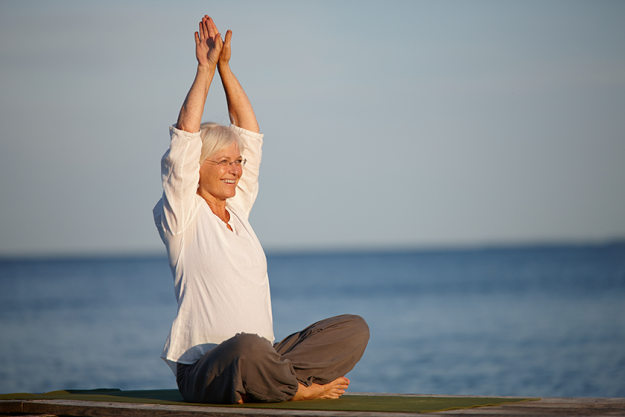 mature happy woman yoga meditation