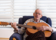 old man playing guitar
