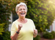 portrait smiling senior woman jogging