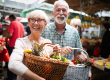senior couple shopping vegetables fruits market