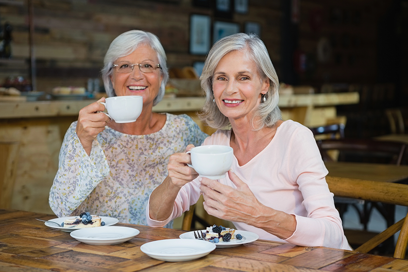 senior friends having coffee and breakfast