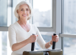 senior woman using gym equipment