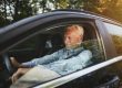 Senior,Man,Smiling,While,Sitting,Alone,In,His,Car,Enjoying