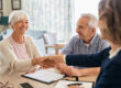 Happy,Old,Woman,Shaking,Hands,With,Medical,Adviser,For,Health