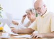 Senior,Man,Checking,Bills,And,Calculating,Costs,Of,Household